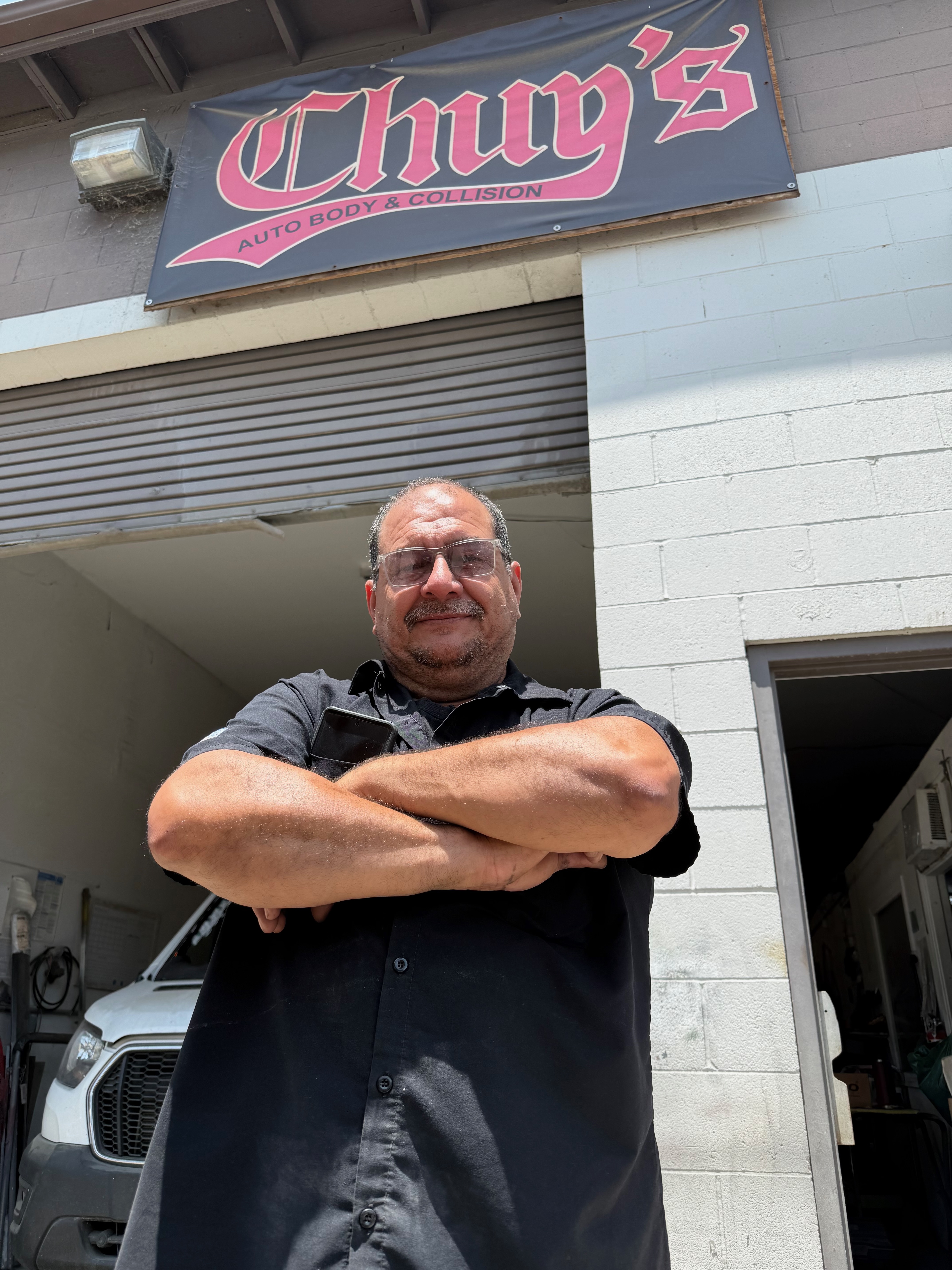 Chuy's Auto Body team working on classic car